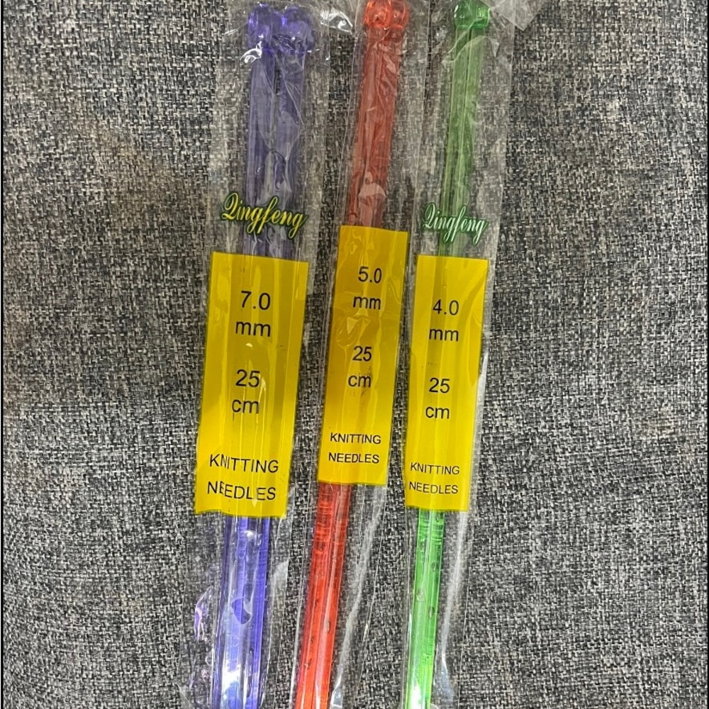 Plastic knitting needles . 3 pairs  green , purple, and orange